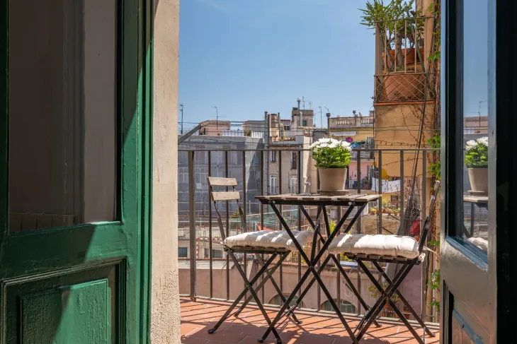 View of Barcelona rooftops from an apartment balcony