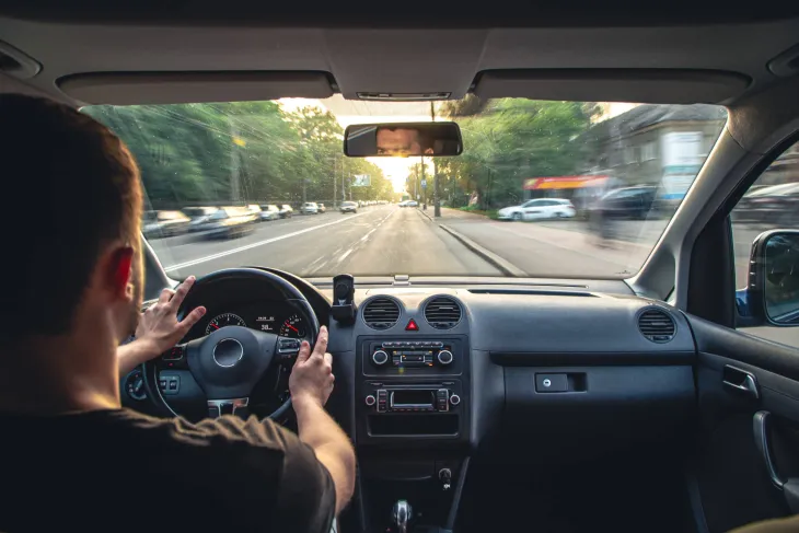 Person driving a car