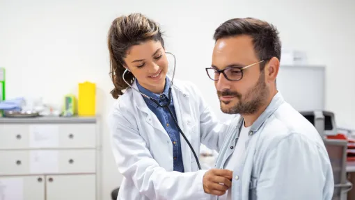 Doctor attending to a patient in a medical consultation room