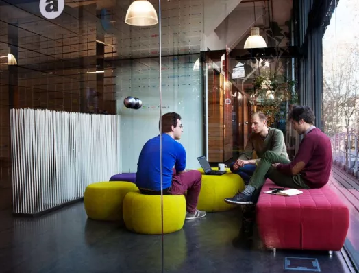 Three young people working on a project at a Barcelona Activa space