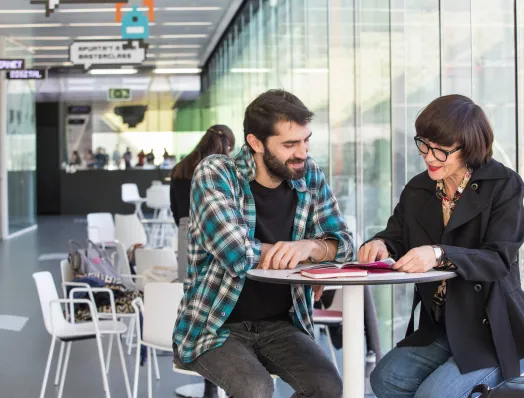 Information officer assisting a visitor in a Barcelona Activa building