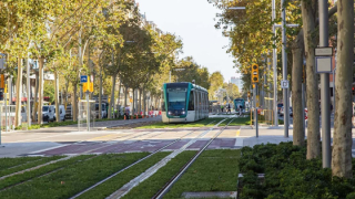 Two trams passing by Diagonal during the blank march along the new section